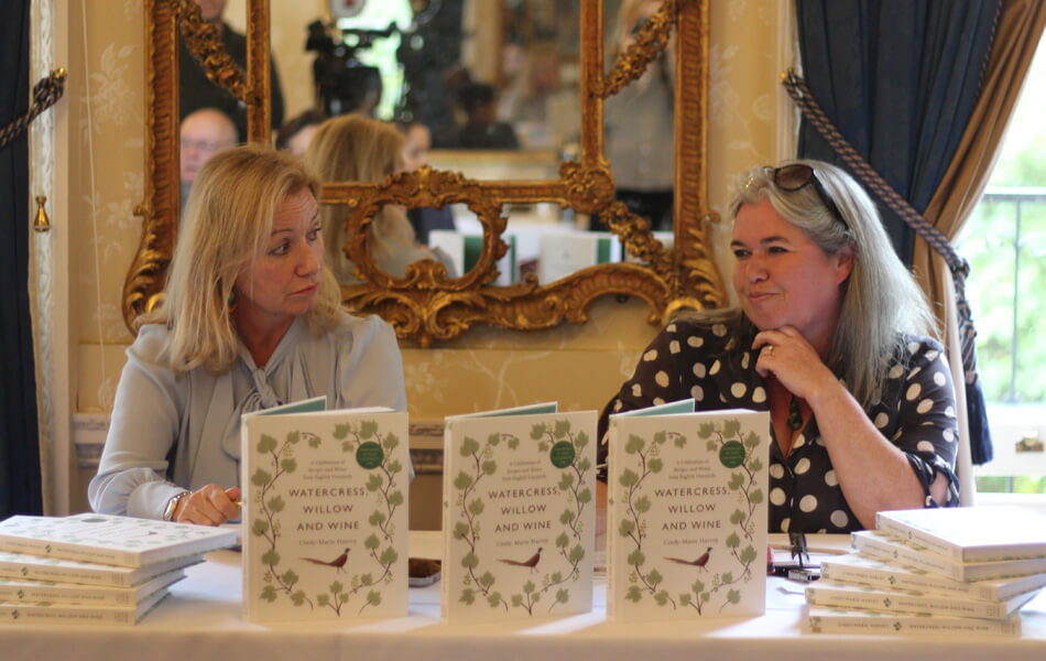 Cindy-Marie Harvey and Deborah Bonetti sat at a table at an FPA briefing conference in London