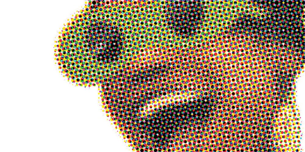 Image of African woman wearing retro sunglasses and smiling