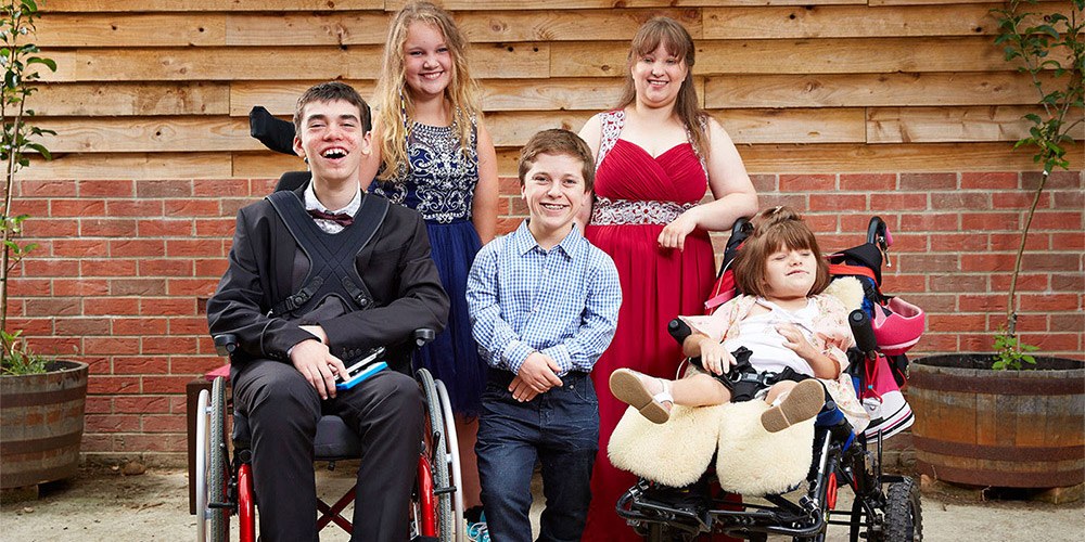 Five teenage participants photographed together