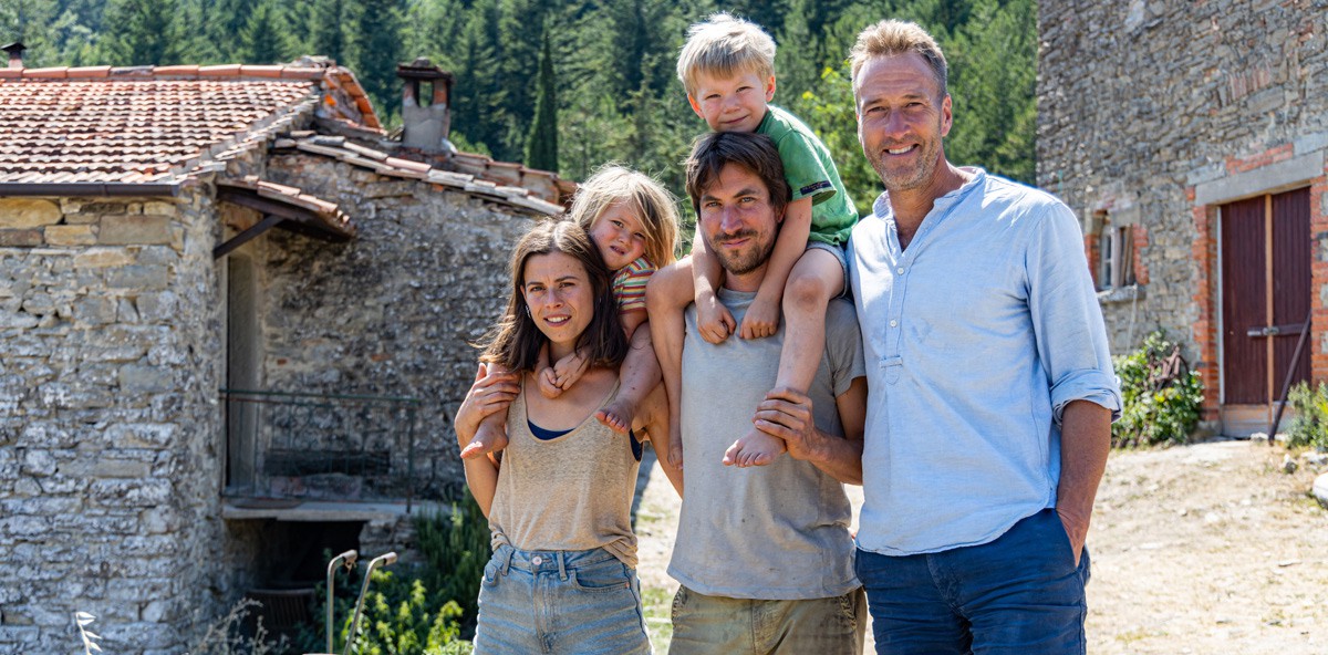 Ben Fogle with British couple George and Sophie in front of their farmhouse in Tuscany